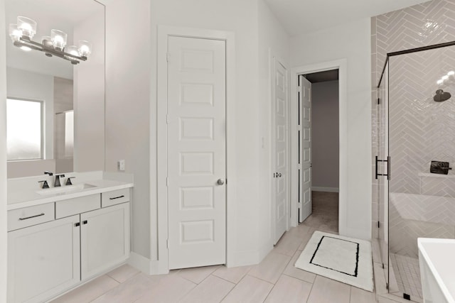 bathroom featuring tile patterned floors, vanity, and an enclosed shower