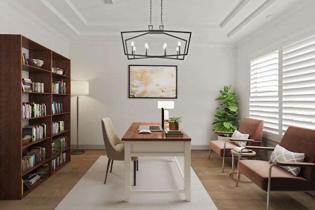 office space with ornamental molding, light hardwood / wood-style floors, a raised ceiling, and a chandelier