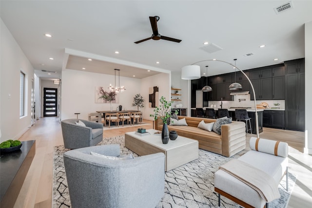 310 E 27th St, Houston, TX 77008 - living area featuring recessed lighting, ceiling fan with notable chandelier, visible vents, and light wood-style flooring