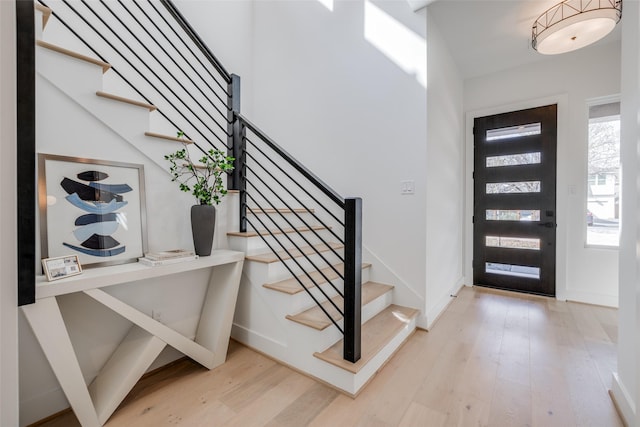 310 E 27th St, Houston, TX 77008 - entrance foyer with stairs, wood finished floors, and baseboards