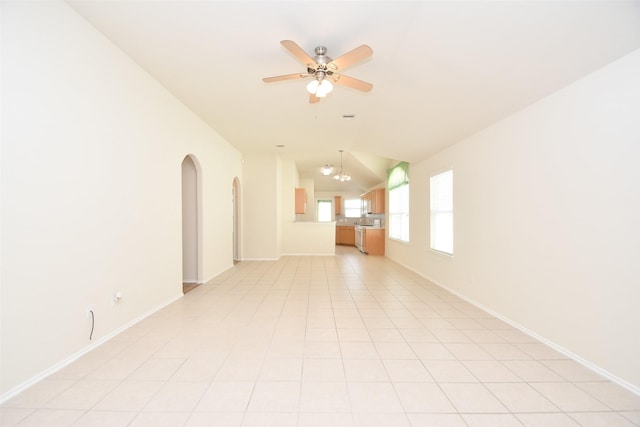 empty room featuring light tile patterned floors and ceiling fan