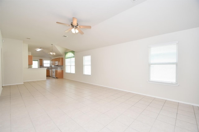 tiled empty room featuring ceiling fan and lofted ceiling