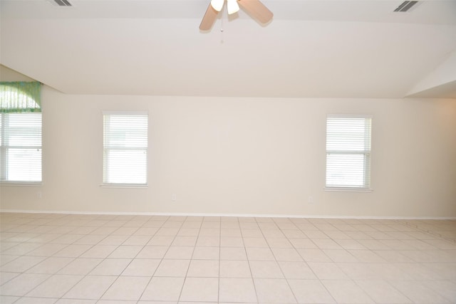 spare room featuring ceiling fan and vaulted ceiling