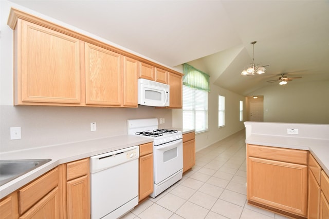 kitchen featuring light tile patterned flooring, vaulted ceiling, light brown cabinetry, hanging light fixtures, and white appliances