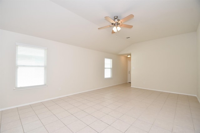 spare room featuring lofted ceiling and ceiling fan