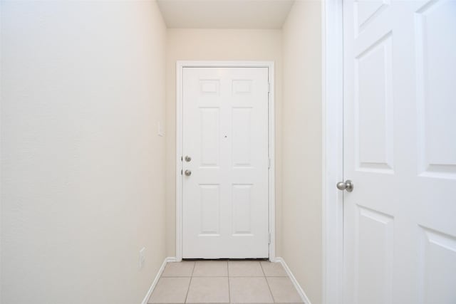 entryway featuring light tile patterned flooring