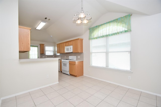 kitchen featuring vaulted ceiling, an inviting chandelier, light brown cabinetry, and white appliances