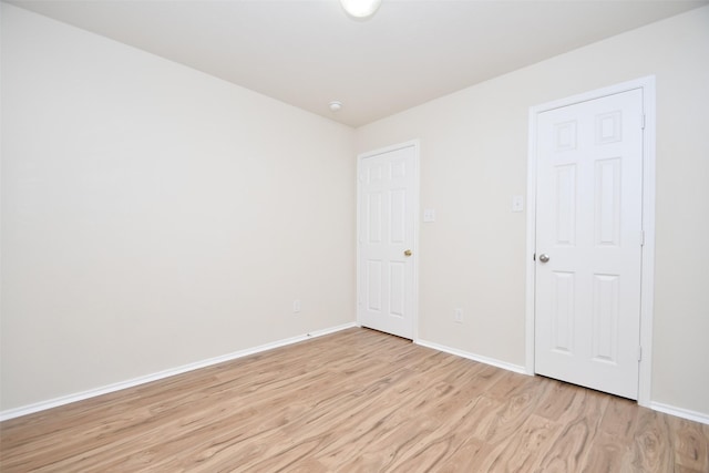 unfurnished room featuring light hardwood / wood-style floors