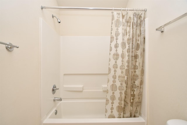 bathroom featuring shower / tub combo with curtain