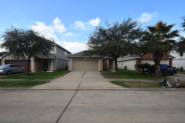 view of front facade featuring a garage and a front lawn