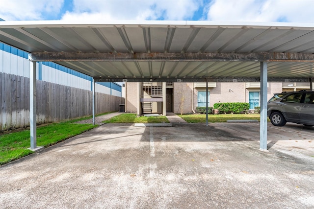 view of parking / parking lot with a carport