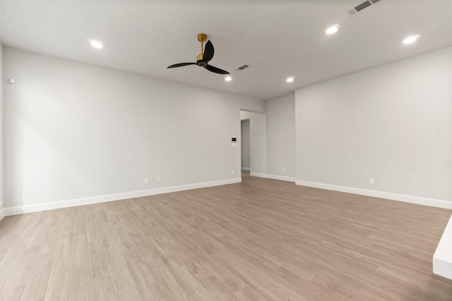 empty room with ceiling fan and light wood-type flooring