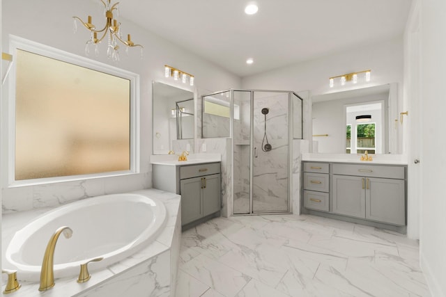 bathroom featuring vanity and shower with separate bathtub