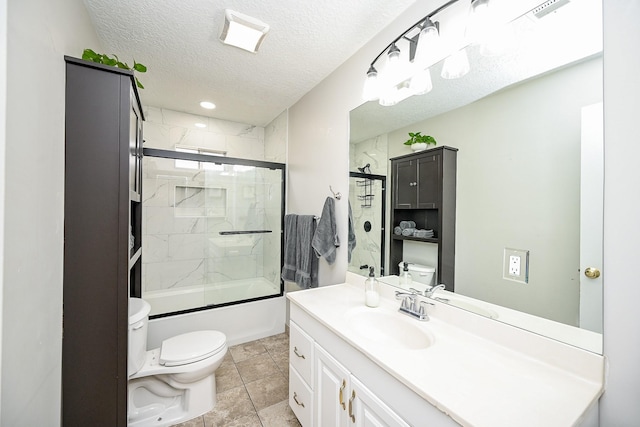 full bathroom featuring combined bath / shower with glass door, vanity, a textured ceiling, tile patterned floors, and toilet