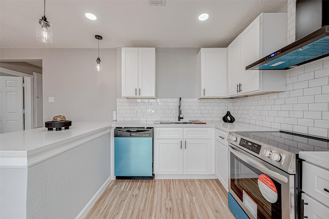 kitchen with white cabinetry, appliances with stainless steel finishes, sink, and wall chimney exhaust hood