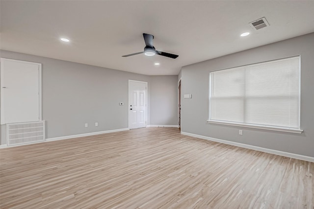 empty room featuring light hardwood / wood-style floors and ceiling fan