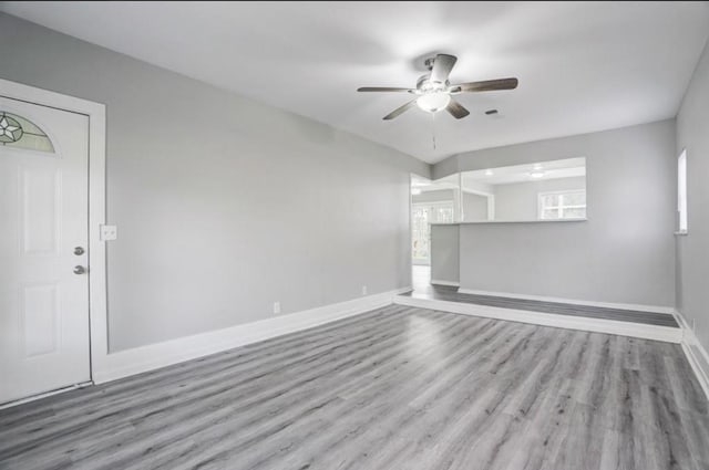 unfurnished room with light hardwood / wood-style floors and ceiling fan