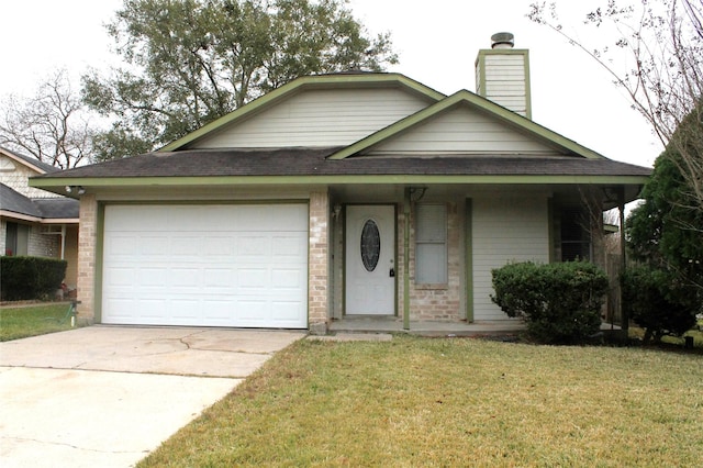 view of front of property with a garage and a front lawn