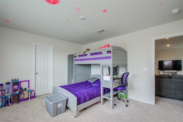 bedroom with light carpet