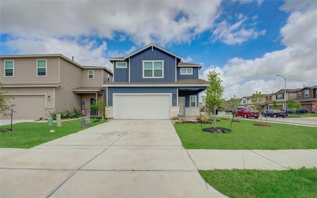 craftsman-style house featuring a garage and a front yard