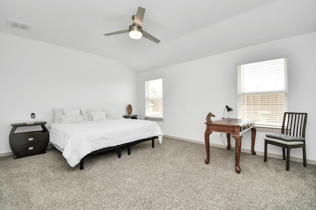 carpeted bedroom with lofted ceiling and ceiling fan