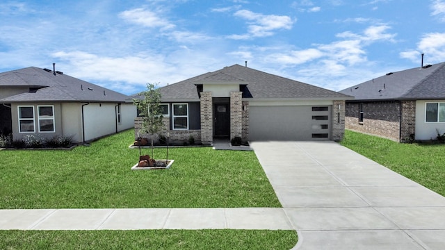 view of front of home with a garage and a front lawn