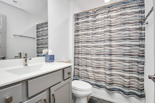 full bathroom featuring vanity, toilet, and shower / bathtub combination with curtain