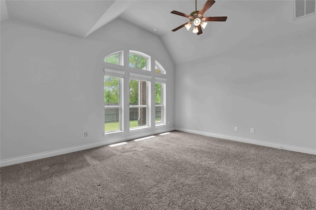 carpeted spare room featuring high vaulted ceiling and ceiling fan