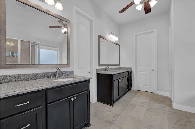 bathroom featuring ceiling fan, vanity, and a shower with shower door