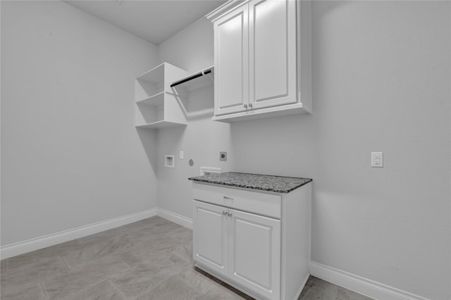 laundry area featuring cabinets, hookup for an electric dryer, and hookup for a washing machine