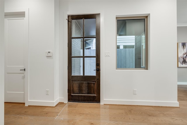 entryway with light hardwood / wood-style flooring