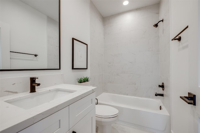 full bathroom with vanity, toilet, and tiled shower / bath