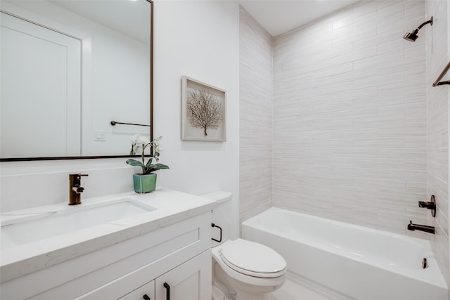 full bathroom featuring vanity, tiled shower / bath combo, and toilet