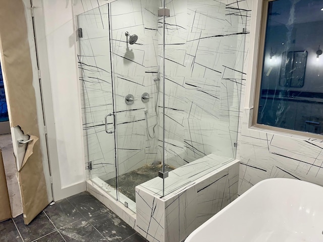 bathroom with shower with separate bathtub