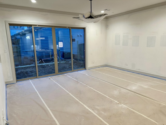 unfurnished room with concrete floors