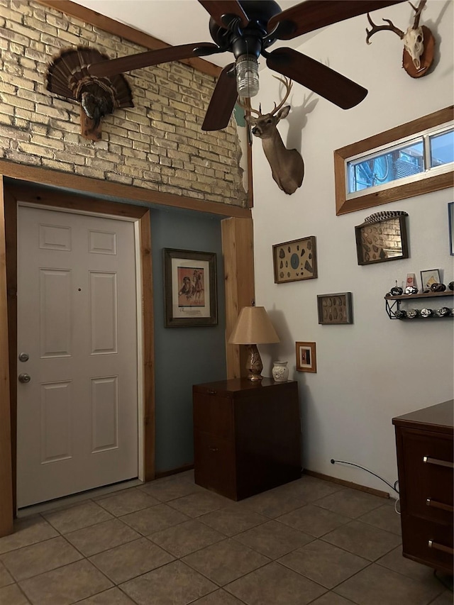 foyer with tile patterned flooring and ceiling fan