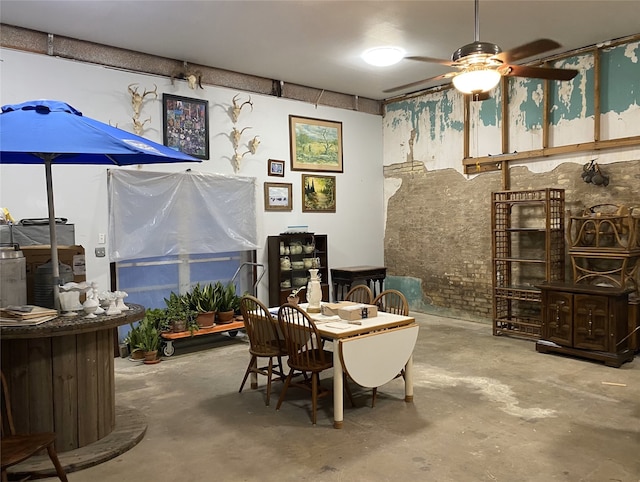 interior space with ceiling fan and concrete flooring