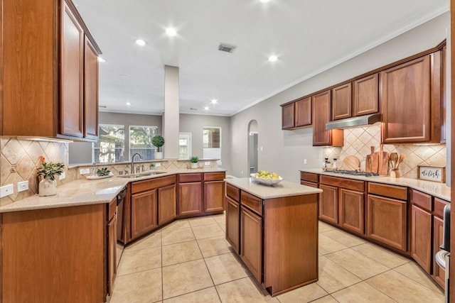 kitchen with sink, light tile patterned floors, a center island, and stainless steel gas stovetop