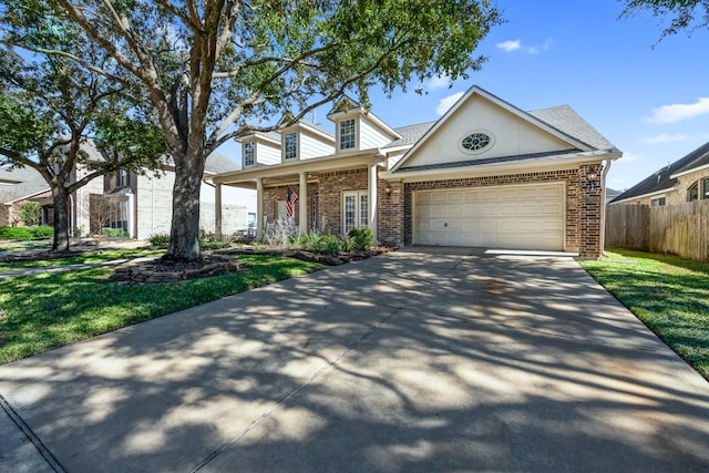 view of front of house featuring a garage and a front lawn