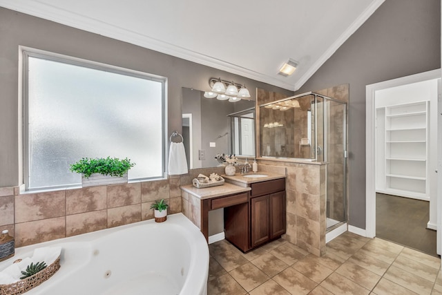 bathroom with lofted ceiling, vanity, ornamental molding, and independent shower and bath