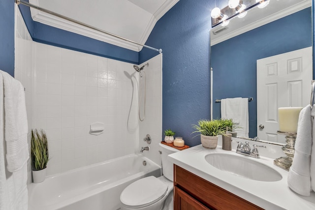 full bathroom featuring crown molding, tiled shower / bath, vanity, and toilet