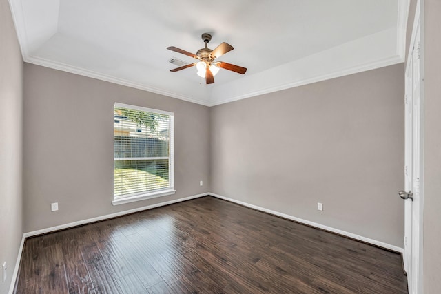 spare room featuring ceiling fan, ornamental molding, and dark hardwood / wood-style floors