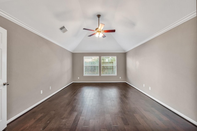 spare room featuring lofted ceiling, dark wood-type flooring, ornamental molding, and ceiling fan