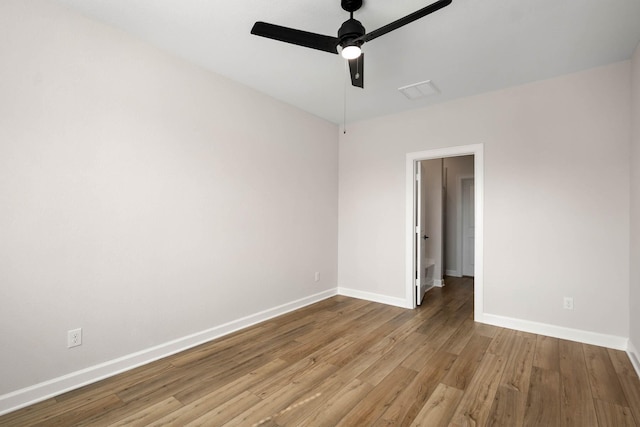 spare room featuring ceiling fan and light wood-type flooring