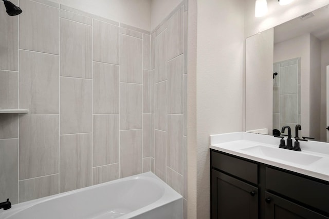 bathroom featuring vanity and washtub / shower combination