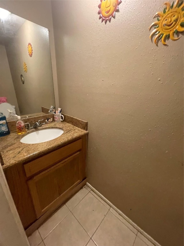 bathroom featuring tile patterned floors and vanity