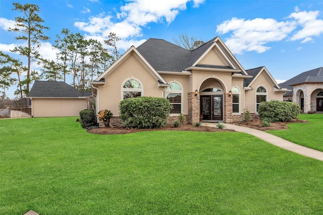 view of front facade featuring french doors and a front lawn