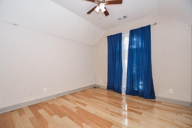 additional living space with ceiling fan, wood-type flooring, and vaulted ceiling