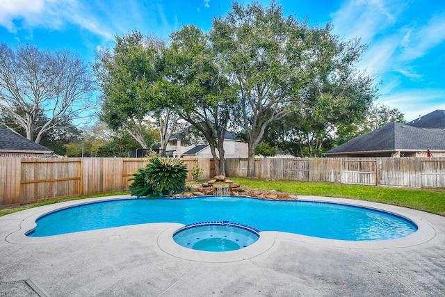 view of swimming pool featuring an in ground hot tub