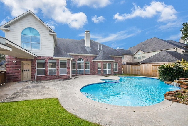 view of pool featuring a patio and an in ground hot tub